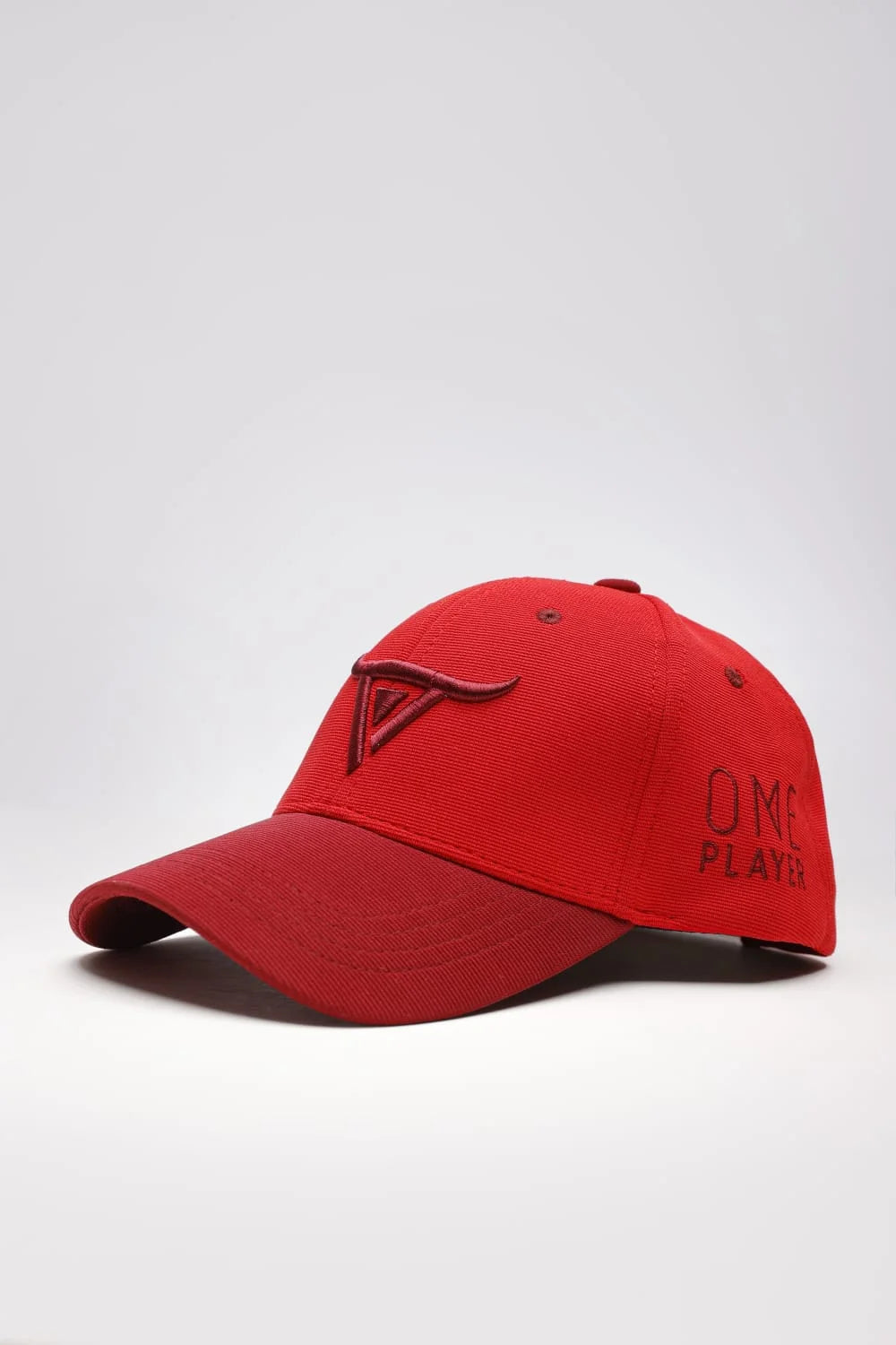Unisex Red solid baseball cap, has a visor by One Player